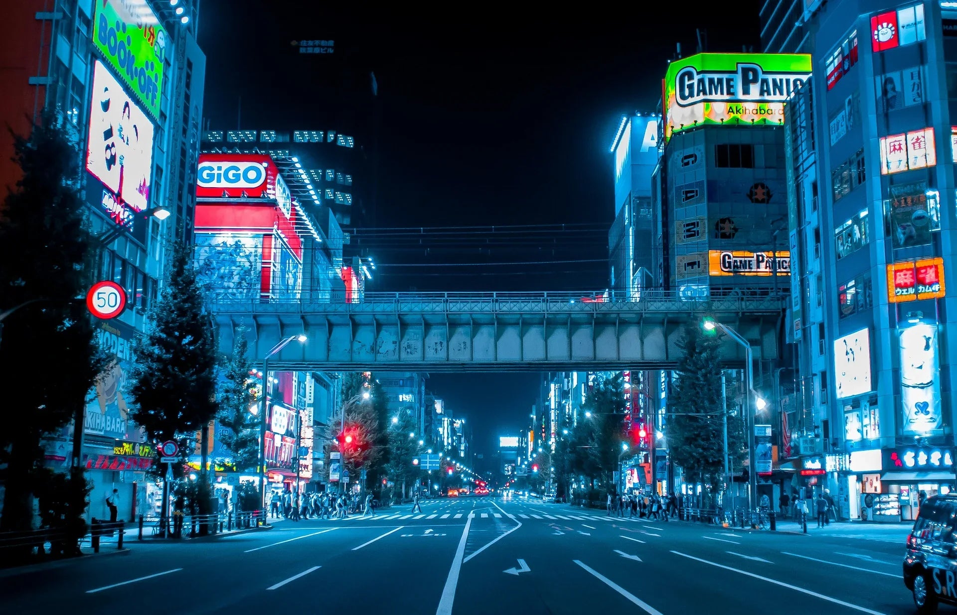 Tokyo’s Akihabara district with retro gaming billboards, hero image for RetroPixl Drops