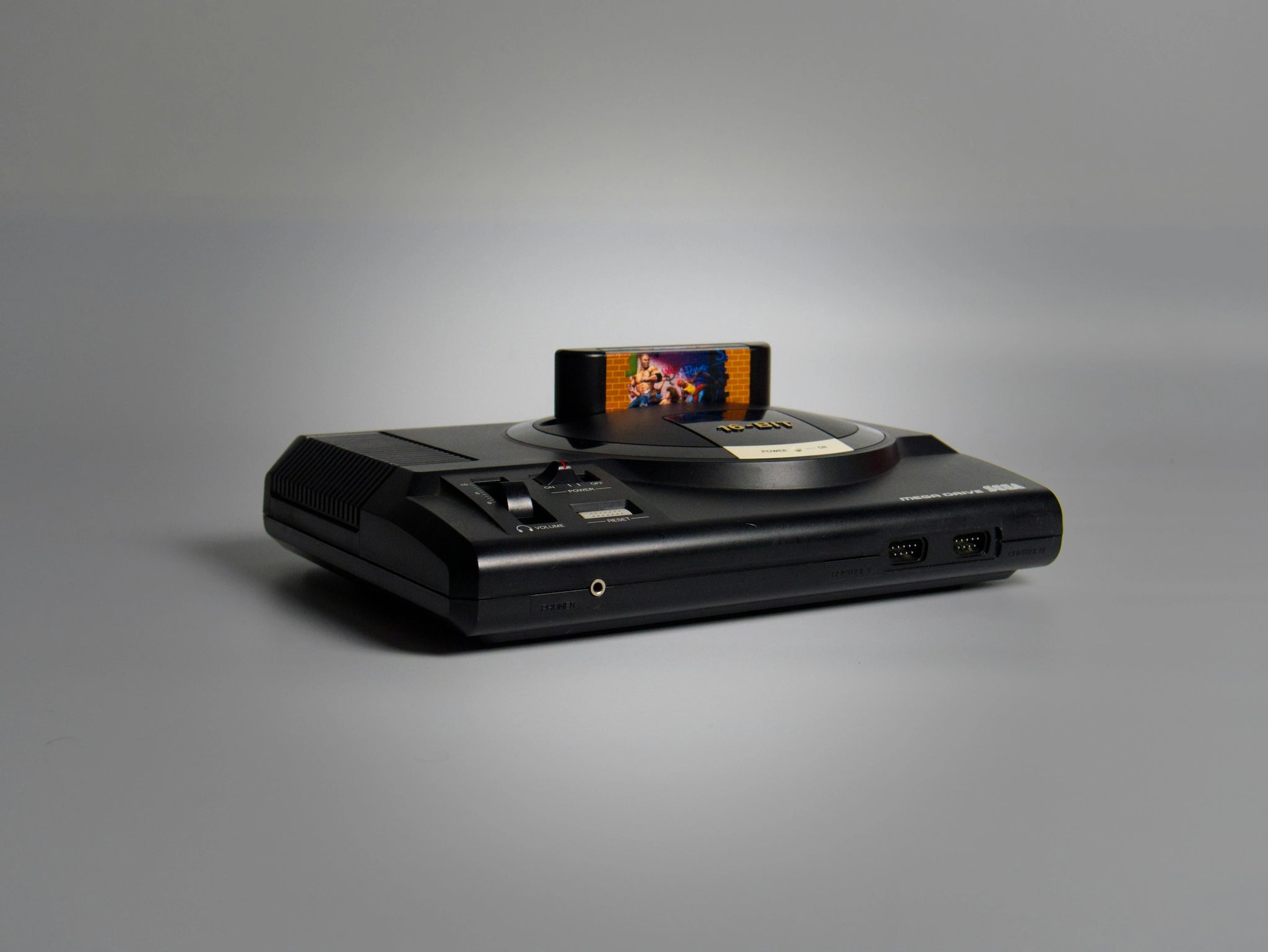 Sega Mega Drive console with game cartridge inserted – RetroPixl Retro Gaming Collection hero image