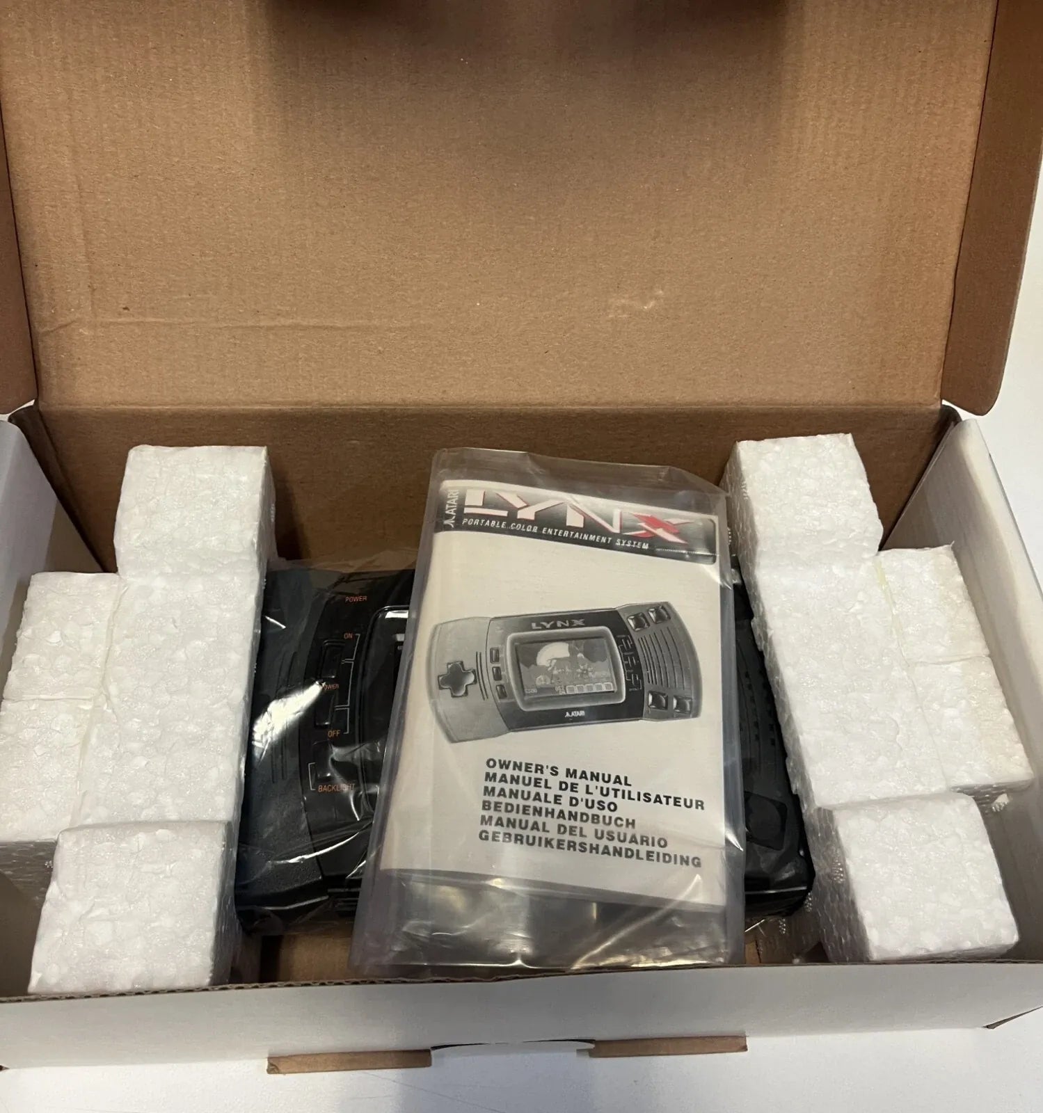 Content of brand new Atari Lynx 2 retro gaming handheld console for players and collectors on RetroPixl