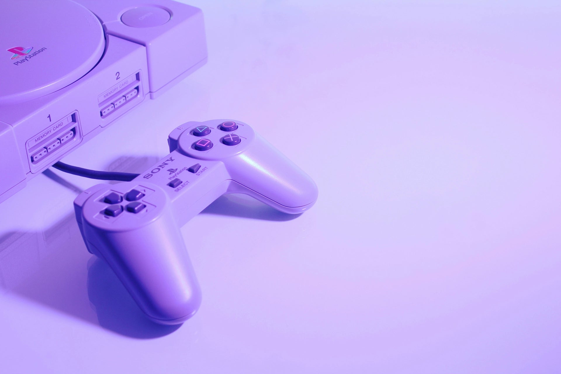 Sony PlayStation console and controller symbolizing RetroPixl’s Retro Refurb service for restoring retro gaming consoles.